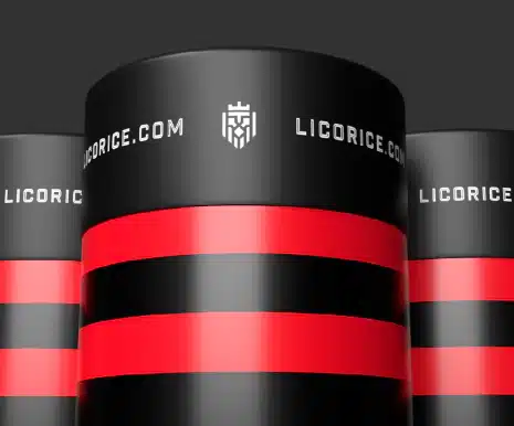 Three black cylindrical containers with bold red stripes and the text "LICORICE.COM" repeatedly printed in white at the top. In the center, there's a shield emblem, highlighting the brand. The background is dark gray.