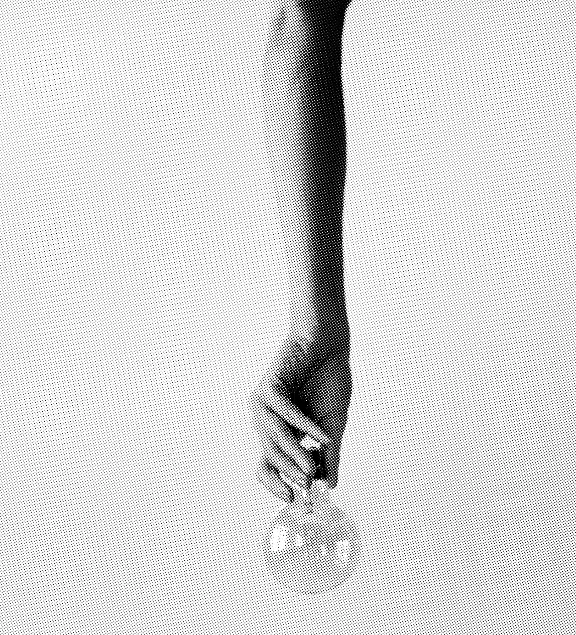A grayscale image shows a person’s arm and hand extended downwards, holding a round glass object, resembling a light bulb or flask, by the fingertips. The background is plain, and the image has a textured, dotted pattern, giving it a vintage or marketing feel.