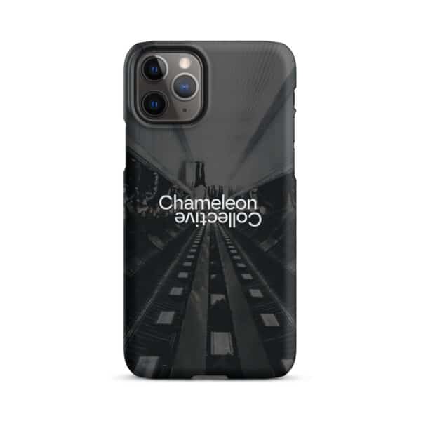 A sleek iPhone case featuring a black and white image of a metro or subway tunnel with tracks extending into the distance. The text "Chameleon Collective" is centered and printed in a mirrored fashion, with one instance right-side-up and the other upside-down. This unique Snap case for iPhone® is the perfect iPhone accessory.