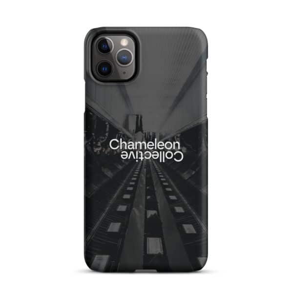 This Snap case for iPhone® features an urban design with a symmetrical photo of an escalator in a modern building. The middle of the image has the words "Chameleon Collective" printed upside down in white, contrasting with the dark-toned background, making it a striking and unique iPhone accessory.