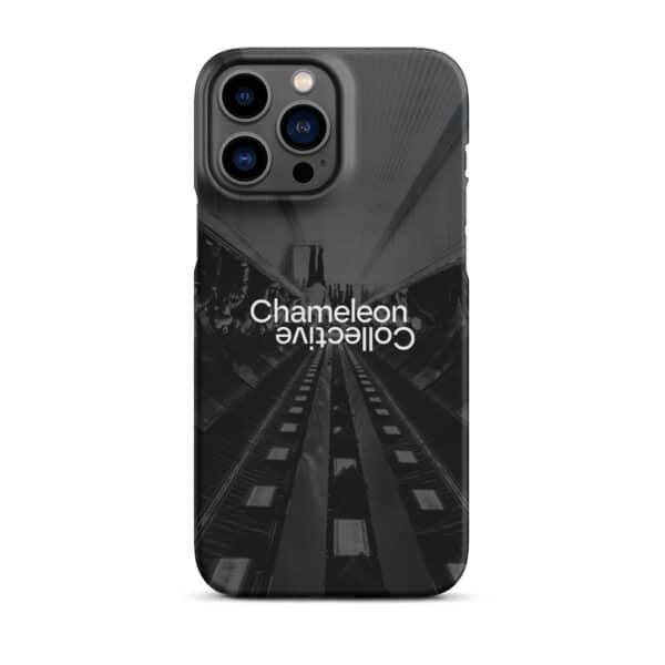 A smartphone adorned with a sleek black Snap case for iPhone® featuring the words "Chameleon Collective." The snap case showcases a dark, abstract urban landscape with symmetrical lines and shapes. The phone's camera lenses are prominently positioned in the top left corner, making it a chic and functional accessory.