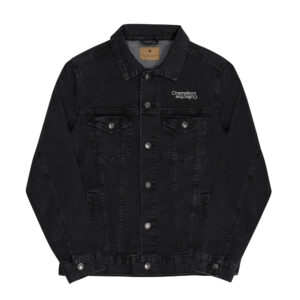 A black unisex denim jacket with long sleeves and a collar. The jacket has two chest pockets with flaps and buttons. On the left chest pocket area, there is a small "Unisex denim jacket" logo in white text.